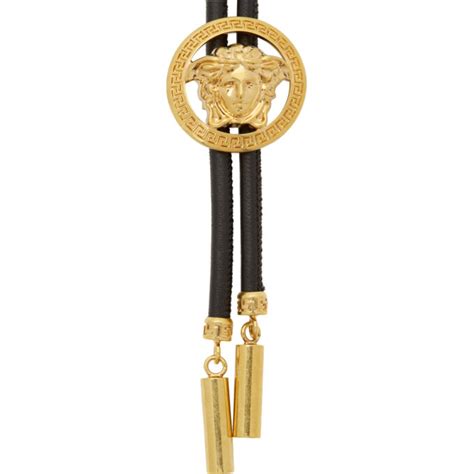 Versace: Black Bolo Tie Necklace .